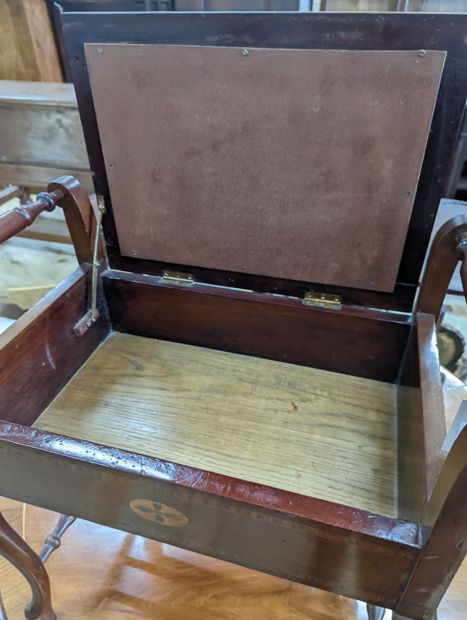 An Edwardian inlaid mahogany piano stool